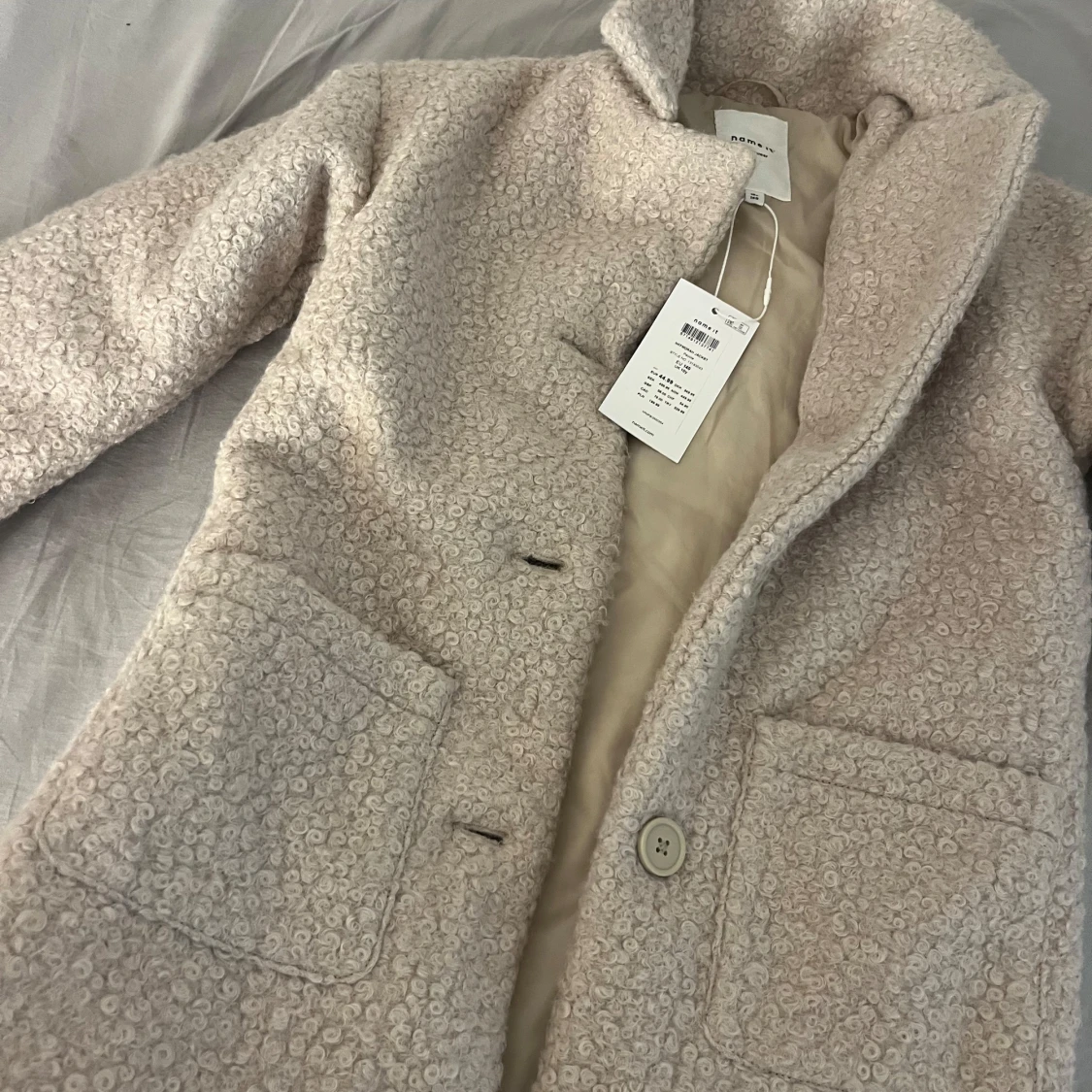 Beige teddyjacka från Name It