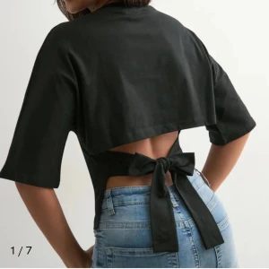 Nelly top - Jätte söt t shirt från Nelly med öppen rygg, storlek S. Åker bort hela juli så kan posta innan dess!!