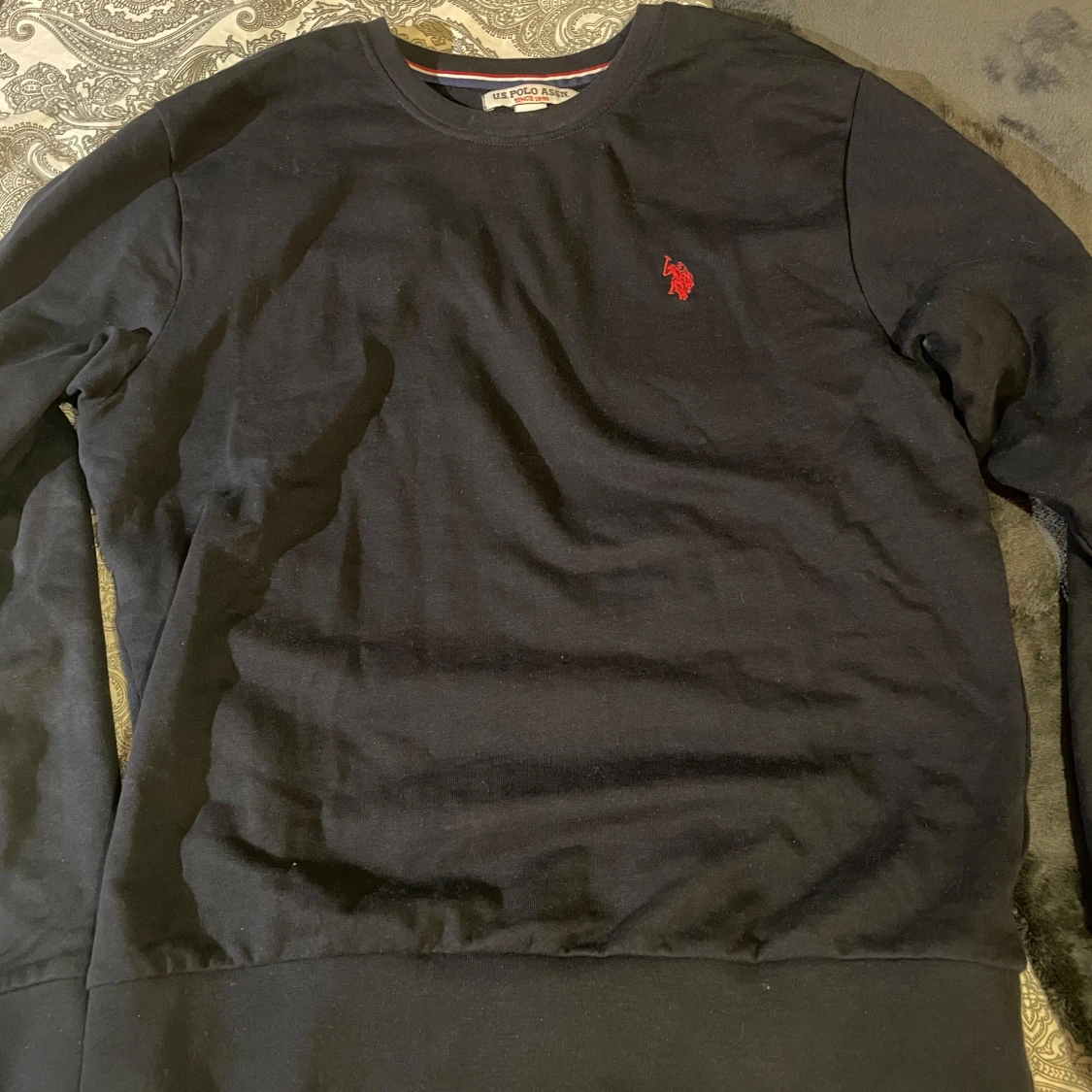 Svart sweatshirt från U.S. Polo Assn.