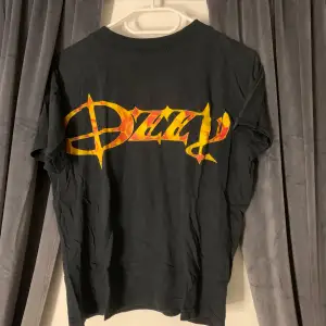 En äldre modell på Ozzy Osbourne - Band tee. Bra skick!