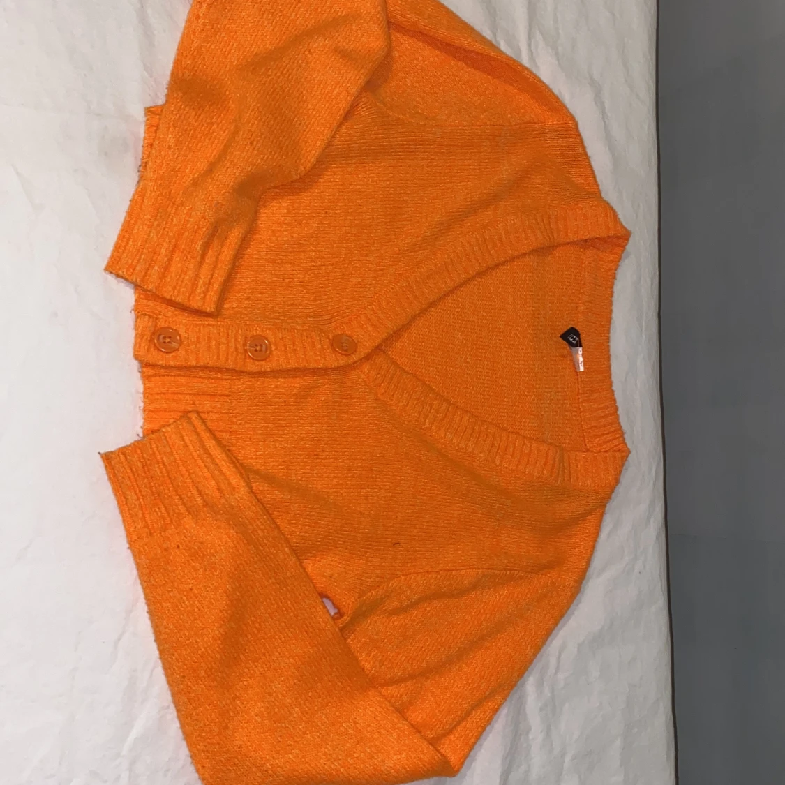 Orange stickad kofta