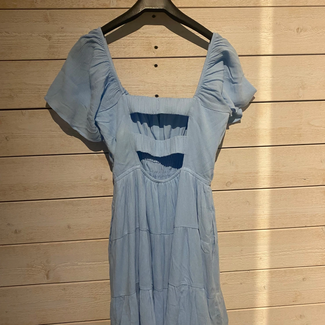 Ljusblå klänning med fickor - 90