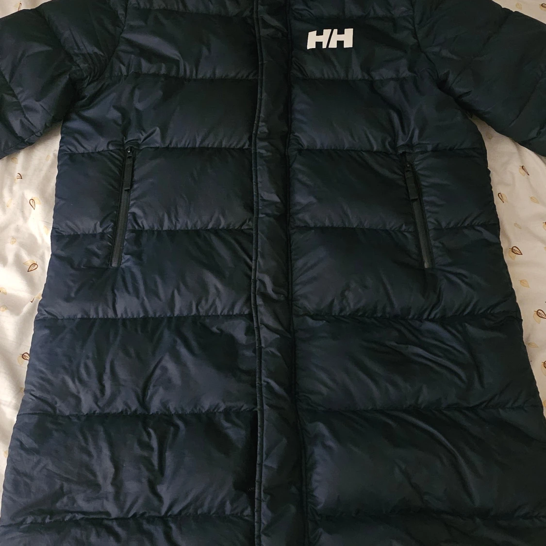 Blå dunjacka från Helly Hansen