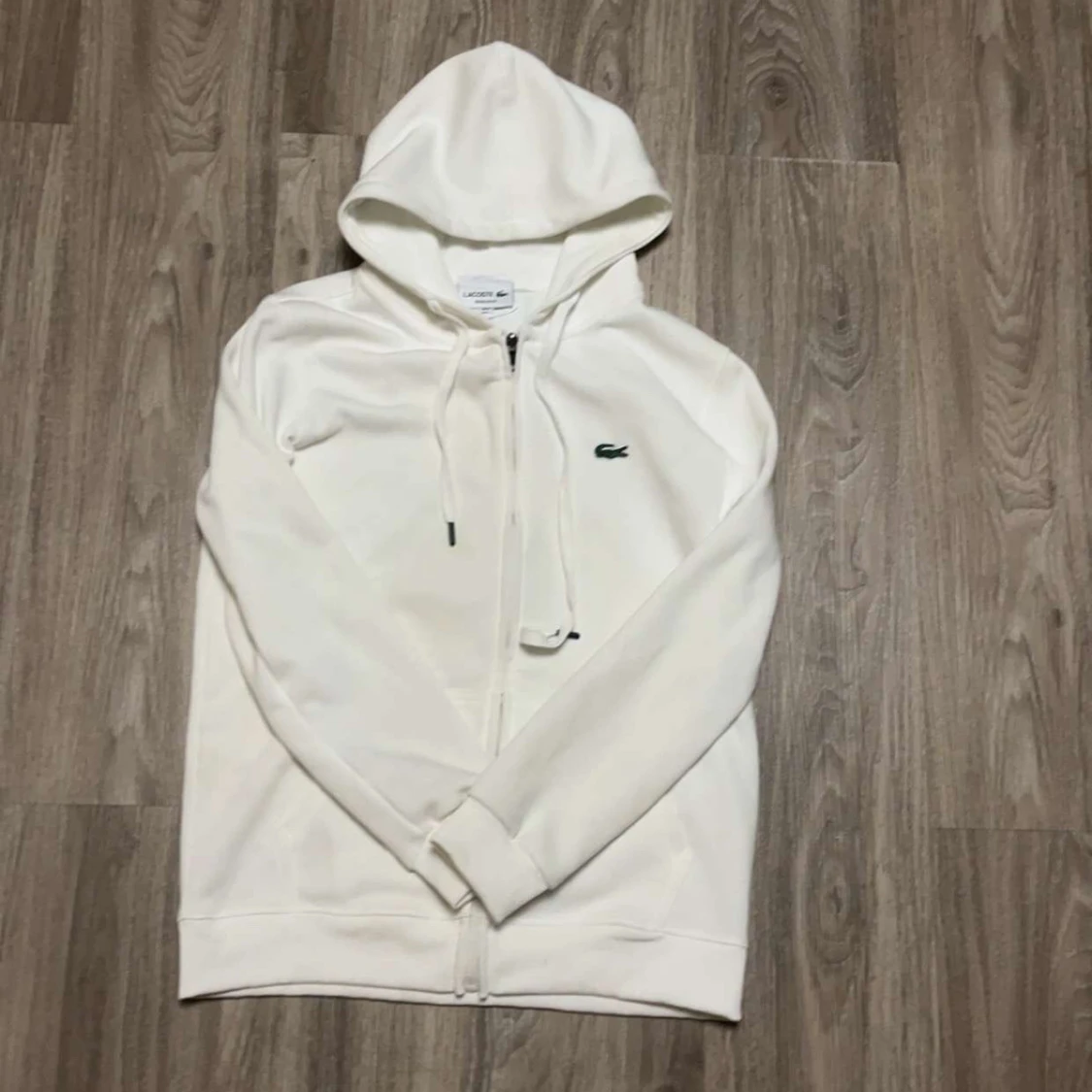 Vit hoodie från Lacoste