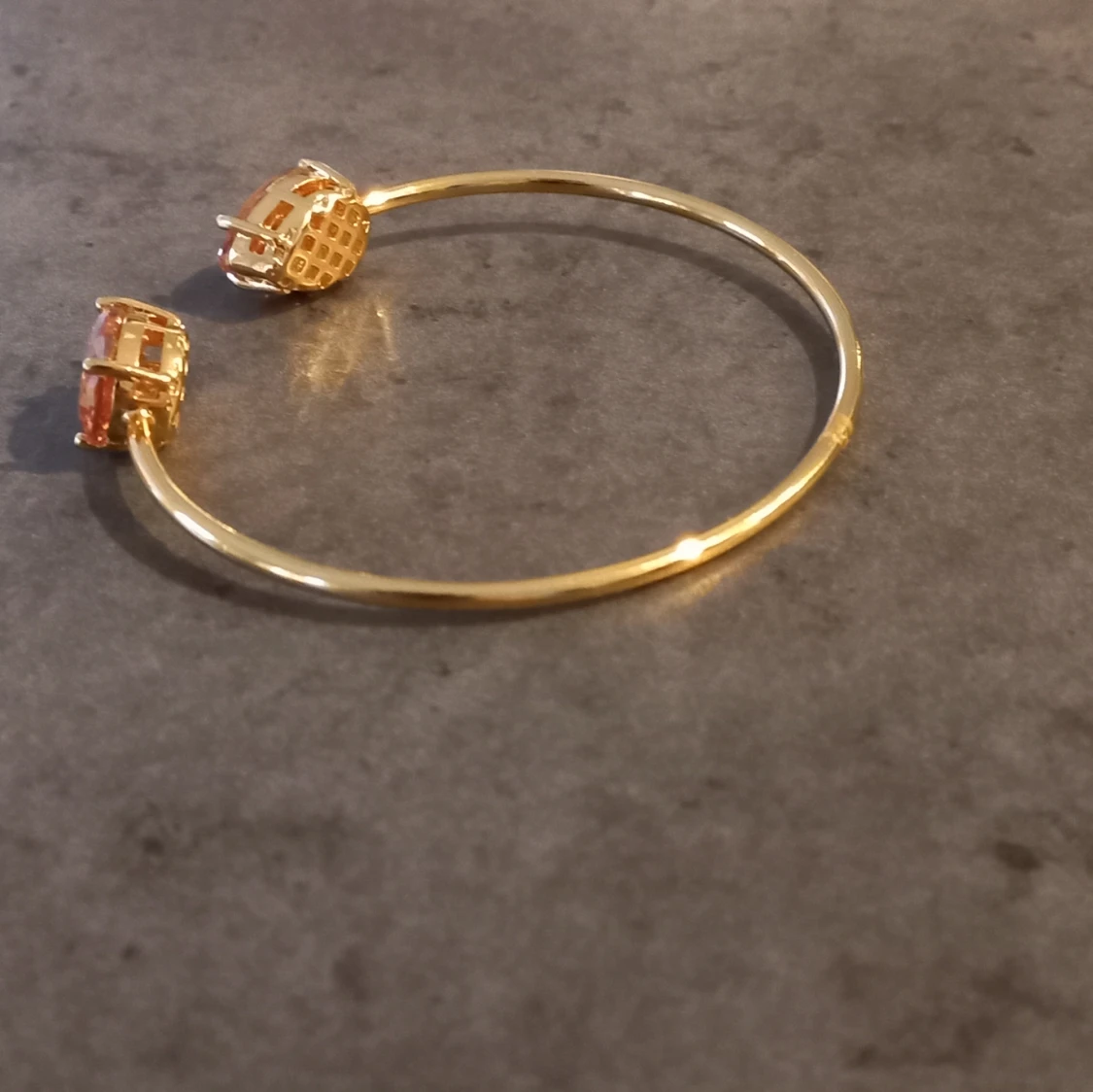 Guldarmband med orange kristaller - 90