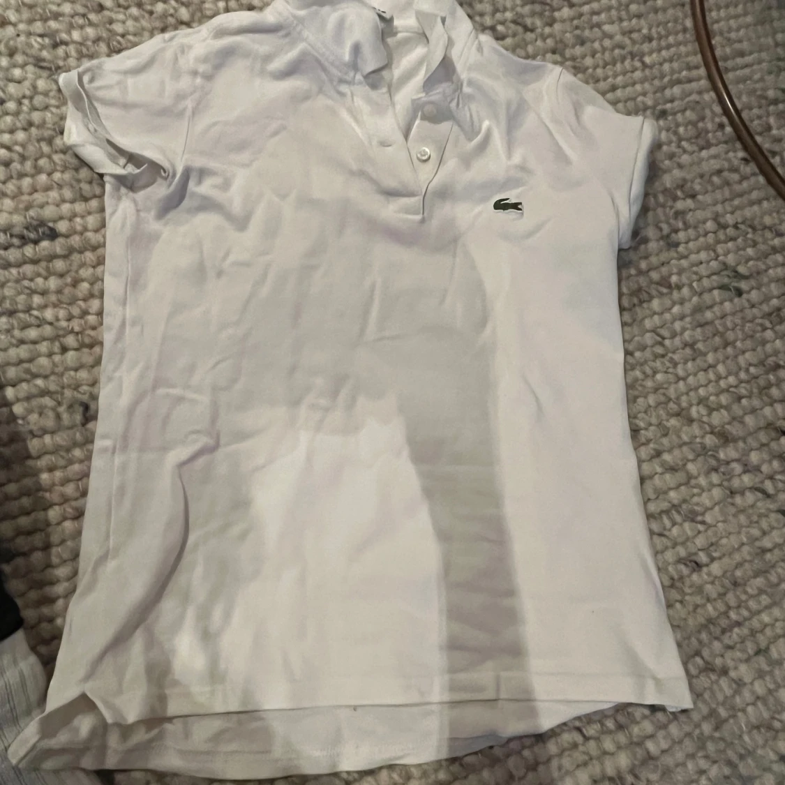 Vit kortärmad pikétröja från Lacoste