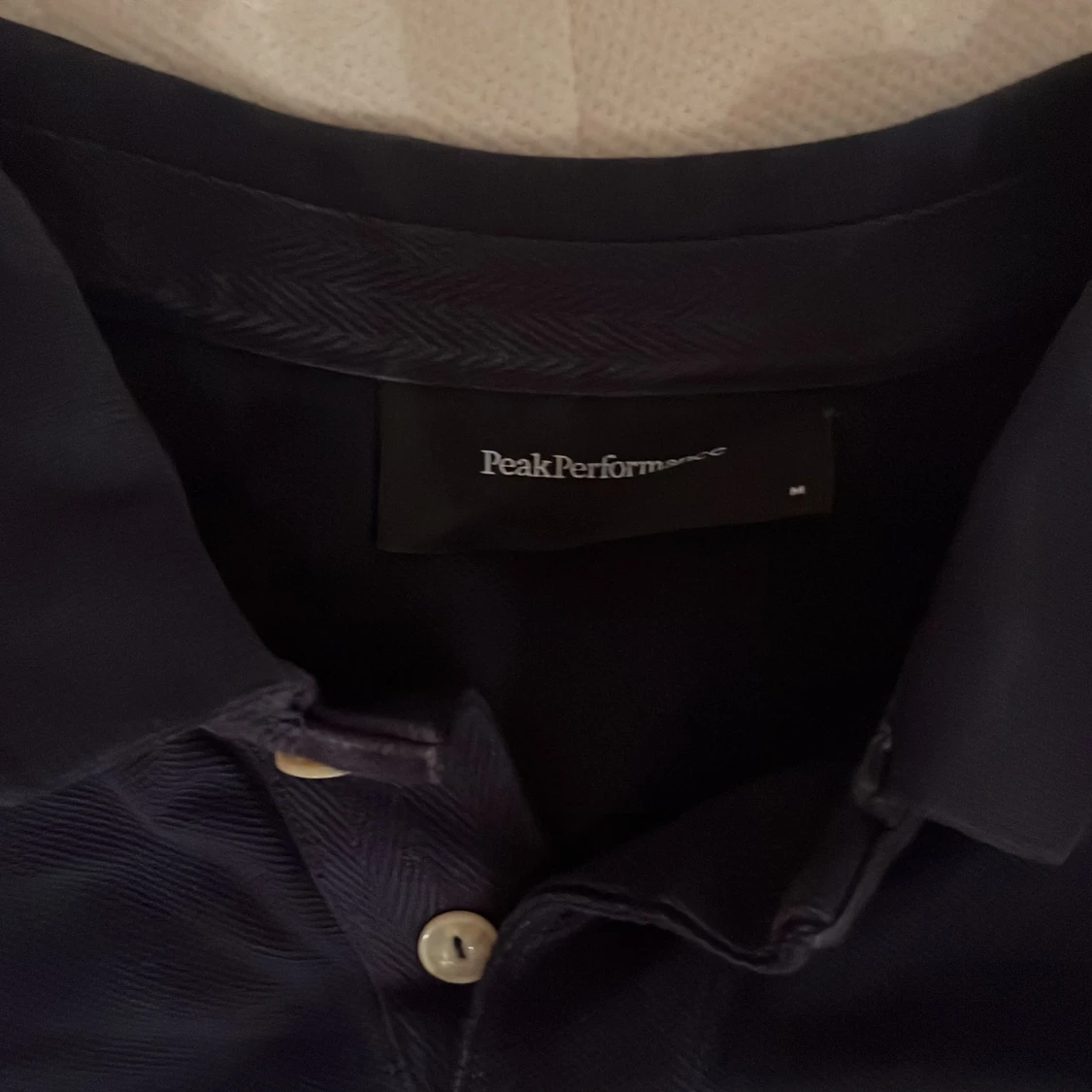 Mörkblå pikétröja från Peak Performance - 91