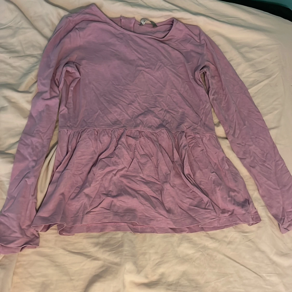 Rosa tröja. Utsvängd