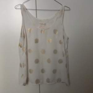 White top with golden dots. Size S. Shipping is not included.