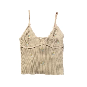 Linne - Gulligt v-ringat beiget linne med broderade små blommor på! Den är i storlek S. Det är små knutar på banden