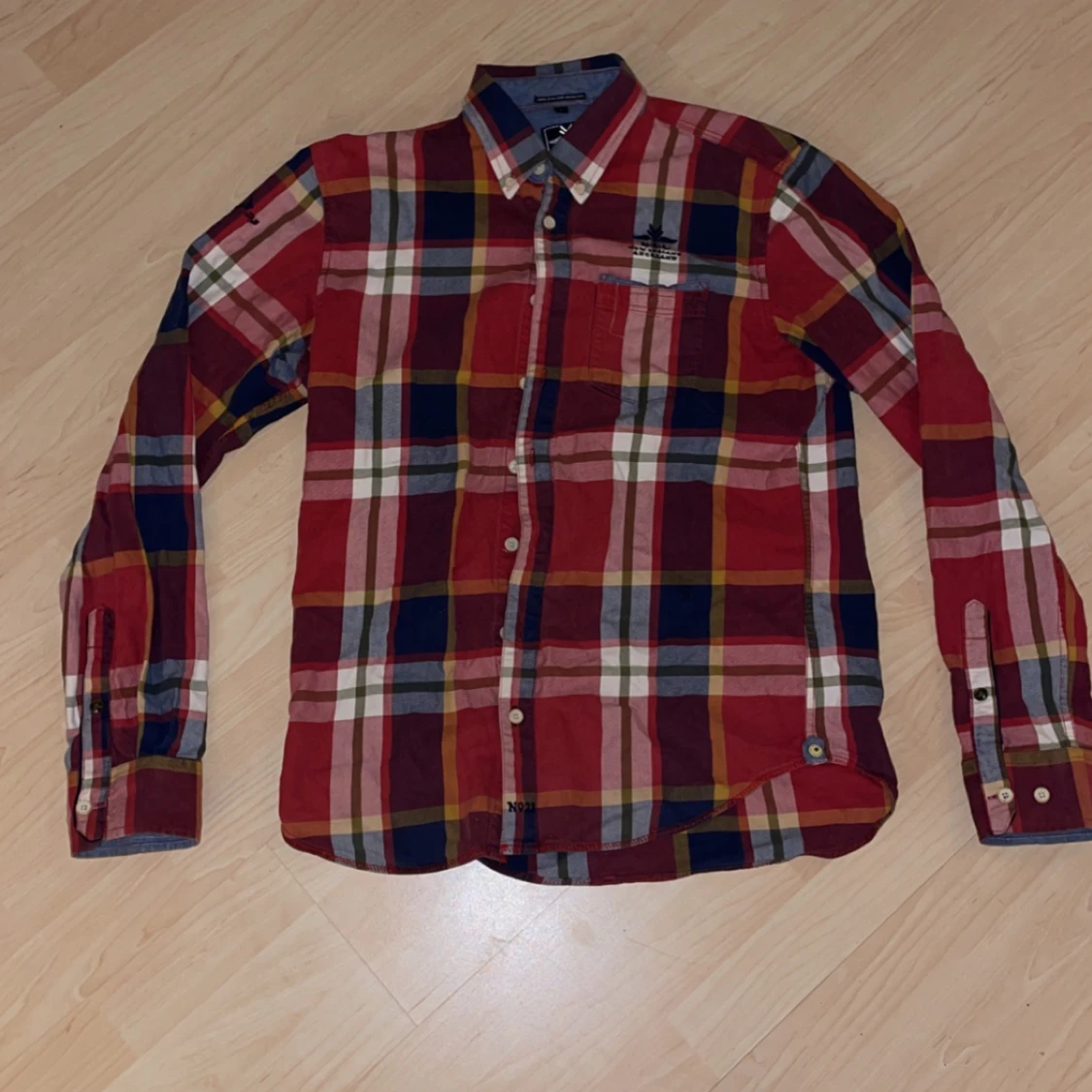 ”New zealand” Röd rutad skjorta