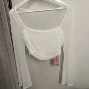 Topp - Långärmad topp helt ny 