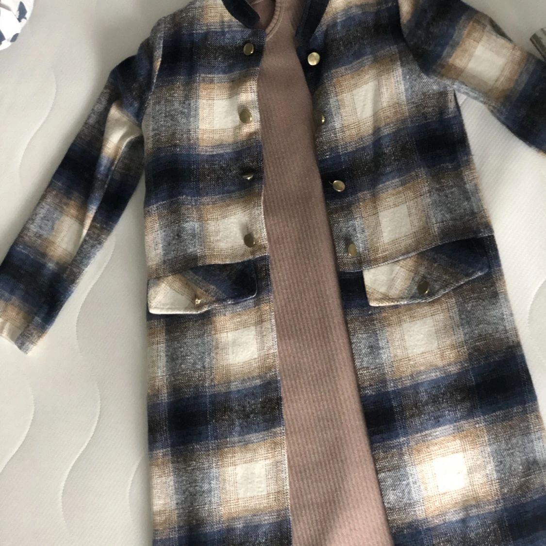 En kappa med en stickat tröja  - 91