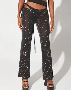 Byxor mesh stjärnor - Festliga delvis genomskinliga byxor med skurning / sexig cut out 