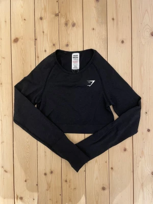 Gymshark långärmad topp - Jättefin Gymshark vital seamless långärmad träningsstopp i storlek M. Passar storlek S.