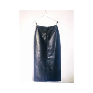  - Genuine unworn leather skirt. 