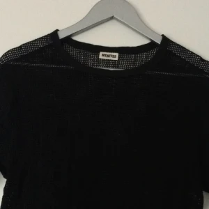  - Nät-tshirt, lite längre modell.