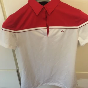  - Ny Johan Lindeberg pikè i funktions material. Storlek M men passar en S(damstorlek), aldrig använd.