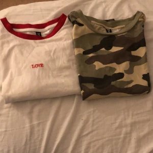 T-shirt  - Vita tröjan: står love och är andvänd Max 3 gånger. Kamouflage tröjan: andvänd Max 3-4 gånger. Båda är i bra skik. Om du vill köpa båda blir det 35kr