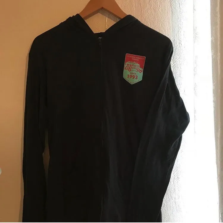 Black stretchy zip hoodie with surf/coffee logo on chest. . Hoodies.