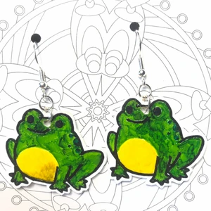 Örhängen groda - Örhängen föreställande en groda gjorda av krympplast. Såklart aldrig använda. Frakt tillkommer på 11 kr. 🐸