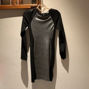 Tight klänning - Svart och grå, använd en gång. 