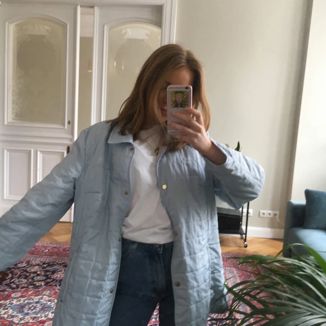 ljusblå tunn dunjacka