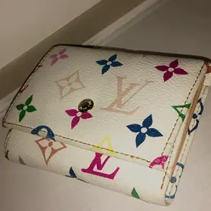 white with colored print Louis Vuitton wallet. Contact for more details.