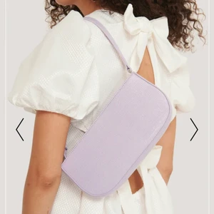 Väska nakd - Så så så fin ljuslila väska💜 säljer då den inte kommit till användning. Köpt på nakd för 349kr. Pris kan diskuteras vid snabb affär.