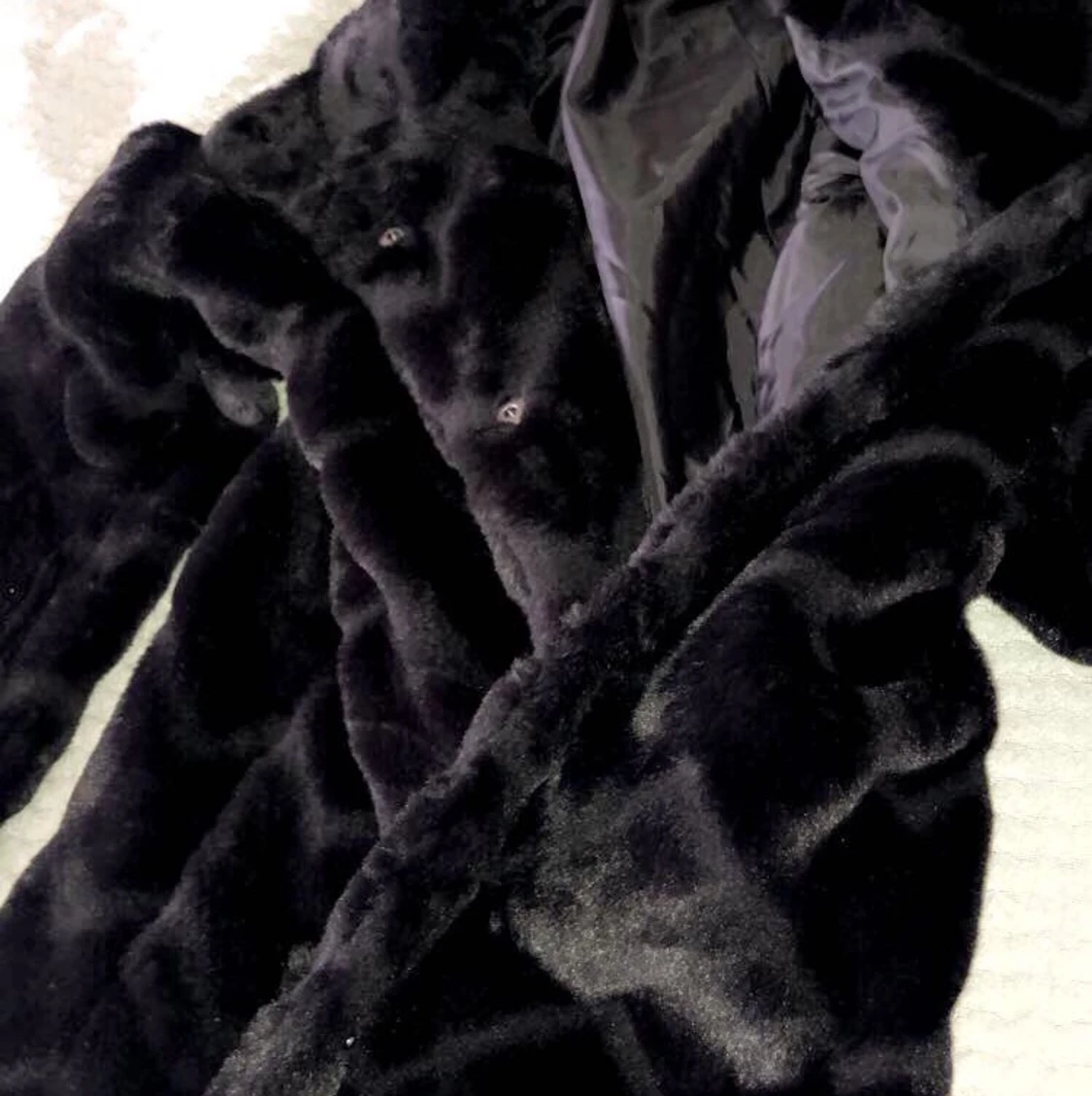 Mysig kappa i fuskpäls