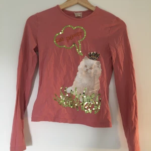Cat power tröja storlek XS - Rosa långärmad tröja med motivet av cat power och paljett detaljer. Storlek XS