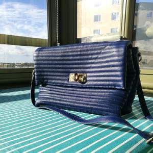 a very elegant blue bag, used two or three times