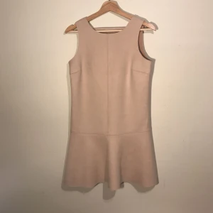  - Tan dress from Mango. I bought this online, and it is too big. I wear an Xs to small and this fits like a medium. Open back design.