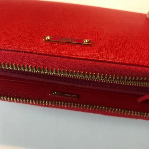 Fendi Red Leather Wallet - Original Fendi leather wallet in condition. Has many slots for credit cards as well as an inner zip slot with Fendi logo. It comes with all original packaging and dust bag.