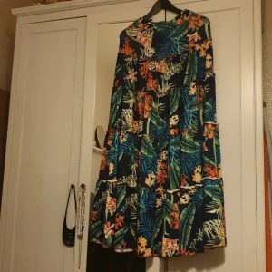 Summer outfit  - Its a beautiful floral skirt with a half top. It fits great for summer. I have only won it once so it is still in its good condition as new. free size for small and medium.