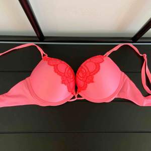 Bombshell Add-2-Cups Push-up Bra with Lace Detail Brand: Victoria’s Secret Size: 34B Colour: Pink / Coral with pink lace detail  Never worn. Really makes you look 1 or 2 sizes bigger.  Super good condition and fit. 