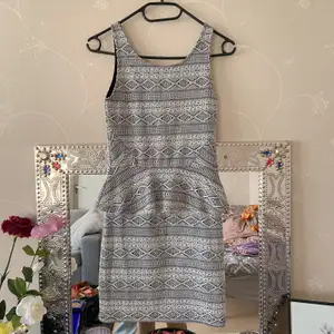 short flirty dress, form fitting , good quality and embroidery design PR: 100kr