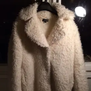 White cozy and warm coat.  Used only a few times.  