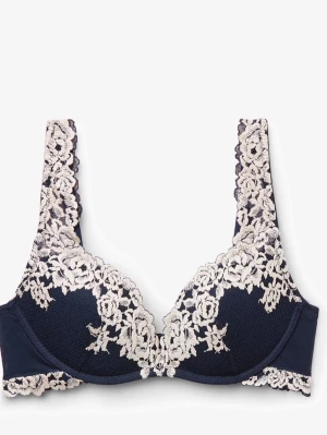 Mörkblå bh med spetsdetaljer - Snygg mörkblå bh med dekorativa spetsdetaljer i vitt. Bh:n har vadderade kupor och breda axelband täckta av spets som ger en romantisk känsla. Perfekt för dig som vill ha något extra fint under kläderna.