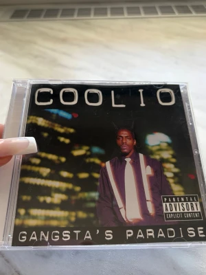 Coolio Gangsta's Paradise CD - CD-albumet 'Gangsta's Paradise' av Coolio i genomskinnt plastfodral. Fodralet har lite repor men cdn är använd 1 gång