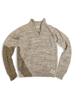 Gråmelerad stickad tröja med halvzip - Mysig gråmelerad stickad tröja med halv dragkedja och hög krage. Tröjan har ribbstickade muddar vid ärmslut och nederkant samt en liten patch vid nederkanten. Perfekt för lager på lager och chill höststil.