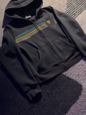 Bape vintage hoodie - Clean black BAPE hoodie with colorful stripe design across the chest – super unique and perfect for a streetwear look.  🖤 Color: Black with multicolor details 📏 Size: S 📦 Condition: Good vintage condition, no major flaws ✨ Details: Full zip, hood, front pockets, classic BAPE style  Perfect for everyday wear or styling fits 🔥 Selling because I don’t wear it anymore.  💬 Message me if you have any questions or want more pictures!
