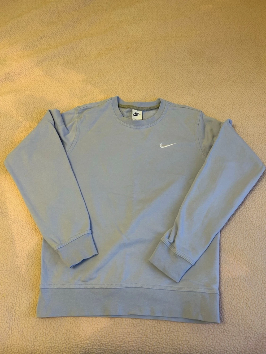 Ljusblå stickad tröja från Nike