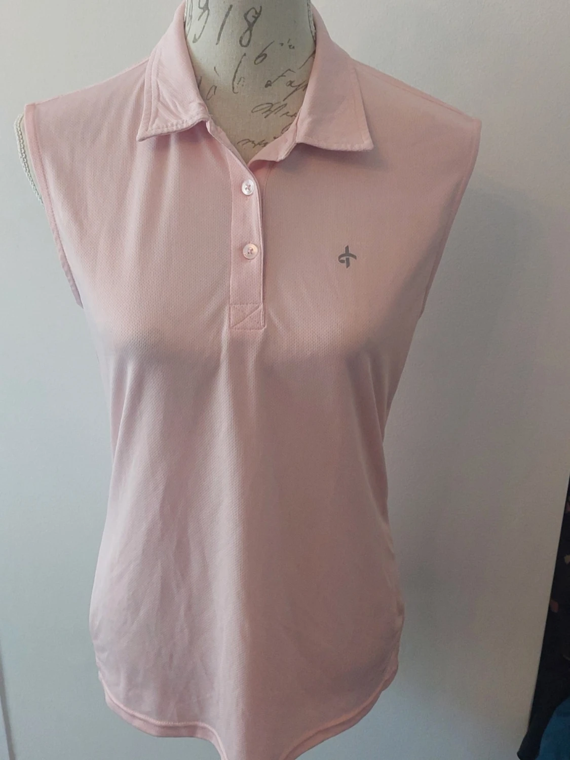 Ljusrosa ärmlös pikétopp Cross