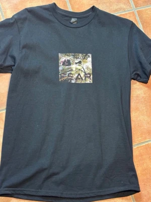 FEAR T-shirt - FEAR “Cruel Society” T-shirt, black. “My own design – ‘The truth is crazy in a world full of lies’.” New, size M. Gildan material