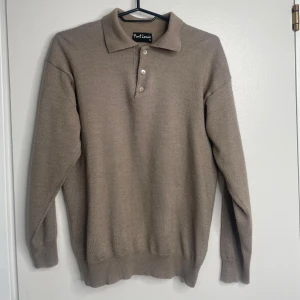 Långärmad Pike - En långärmad pike från Port Louis Väldigt mjukt material känns som merinoull men osäker 