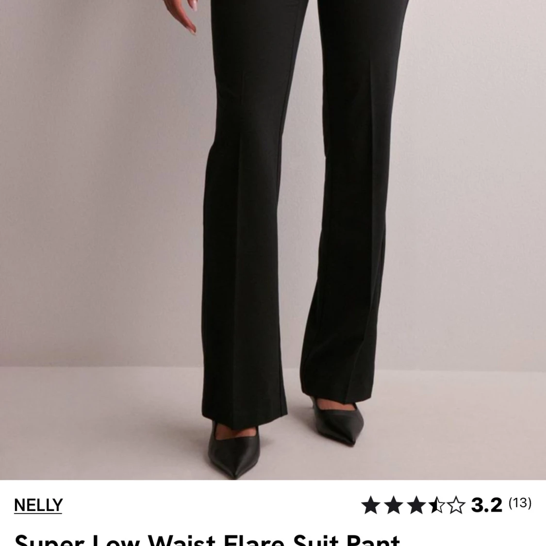 Svarta lågmidjade kostymbyxor från Nelly - 90