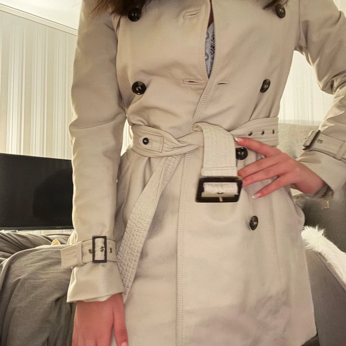 Beige trenchcoat med bälte