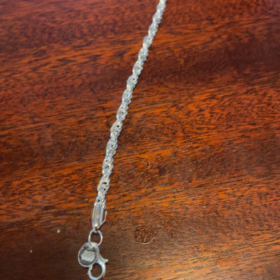 Silverfärgat armband i flätad design - 91