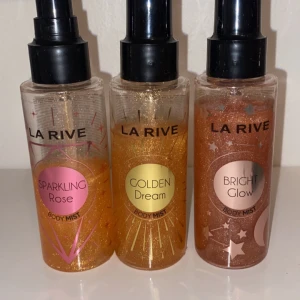 Body Mist från La Rive - Tre olika body mists från La Rive: Sparkling Rose, Golden Dream och Bright Glow. Varje flaska har en glittrig design med matchande färger - rosa, guld och brons. Perfekt för att ge en fräsch och glittrande doft till din dag! Alla tre för 90kr